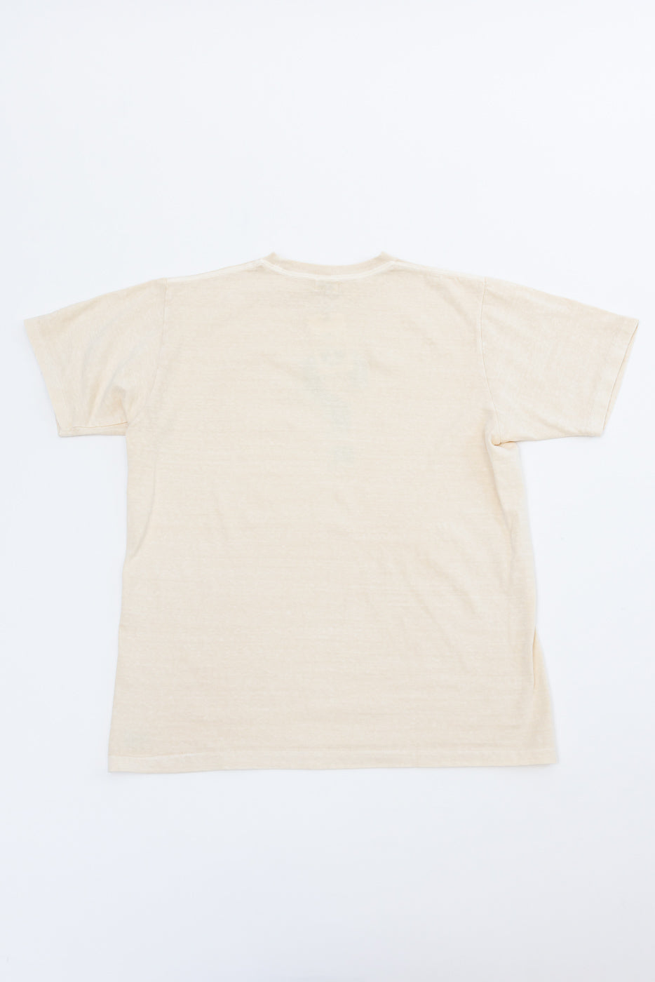 Flat lay back view of cream cotton tee, showing crew neck and straight hem, no graphics