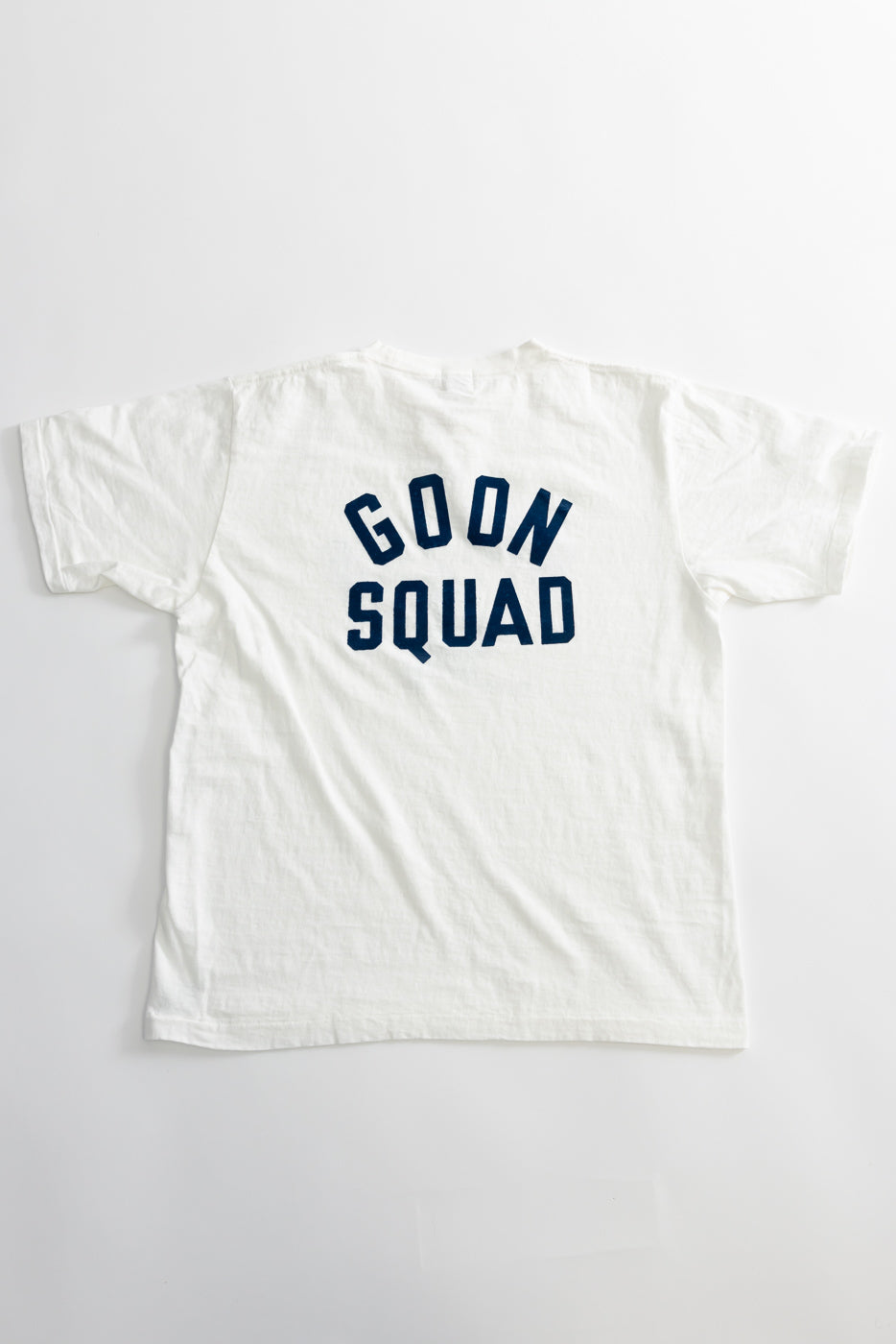 The 5.4oz Raffy Tenjiku Printed T-Shirt Ski Inn - Off White features GOON SQUAD in navy-blue block letters on the back, showcasing vintage-inspired design and premium Japanese craftsmanship.