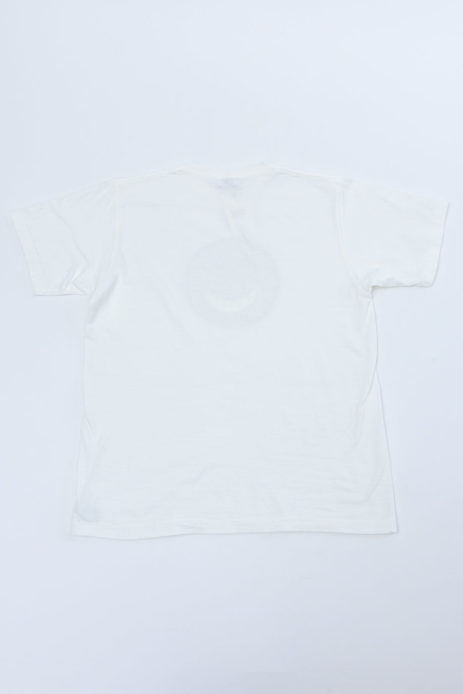 Flat lay showing the back of a plain white short-sleeve t-shirt.