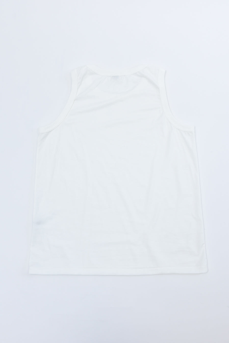 White tank top back view, flat lay, clean hem and shoulder seams, minimalist casual apparel