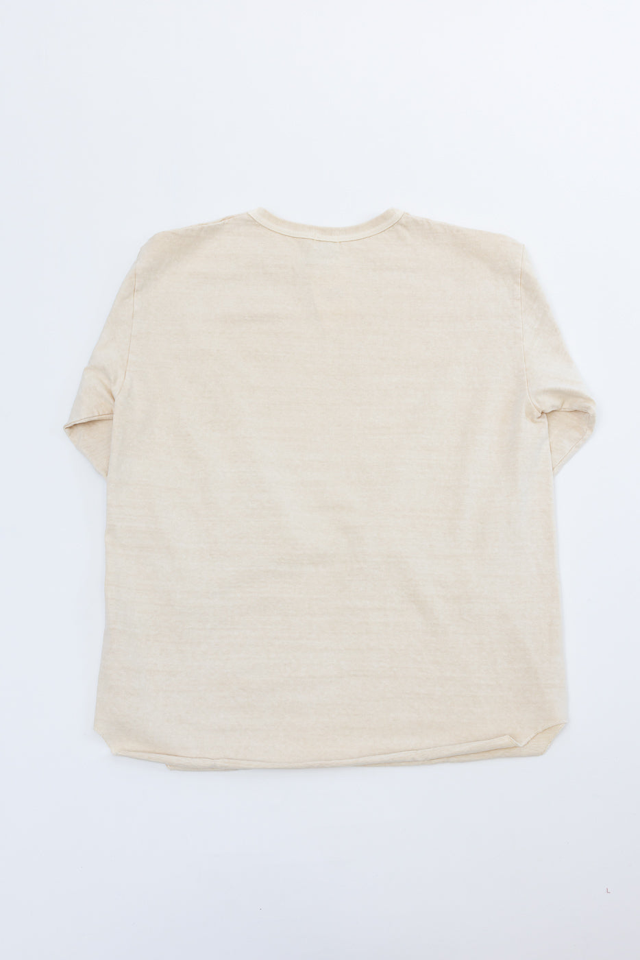 Back view flat lay of beige short sleeve t-shirt, showing rounded hem and relaxed fit