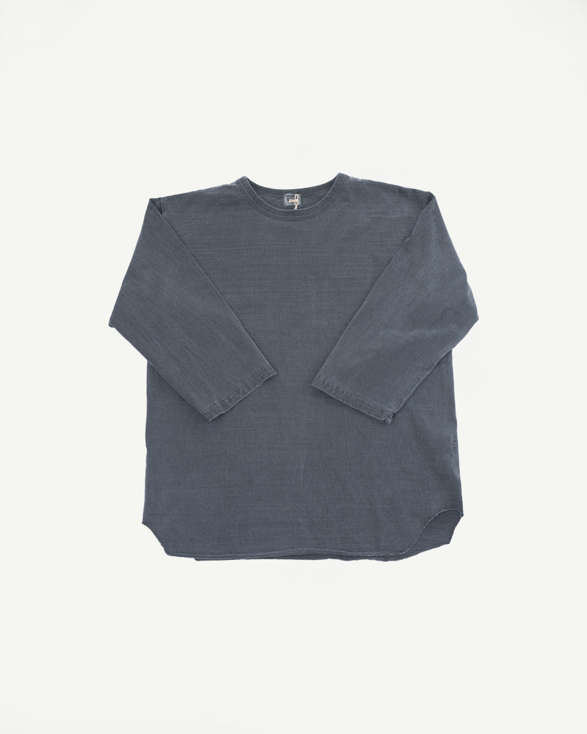 Front flat lay of dark gray long-sleeve crewneck shirt, showing ribbed texture, rounded hem, and tag detail.