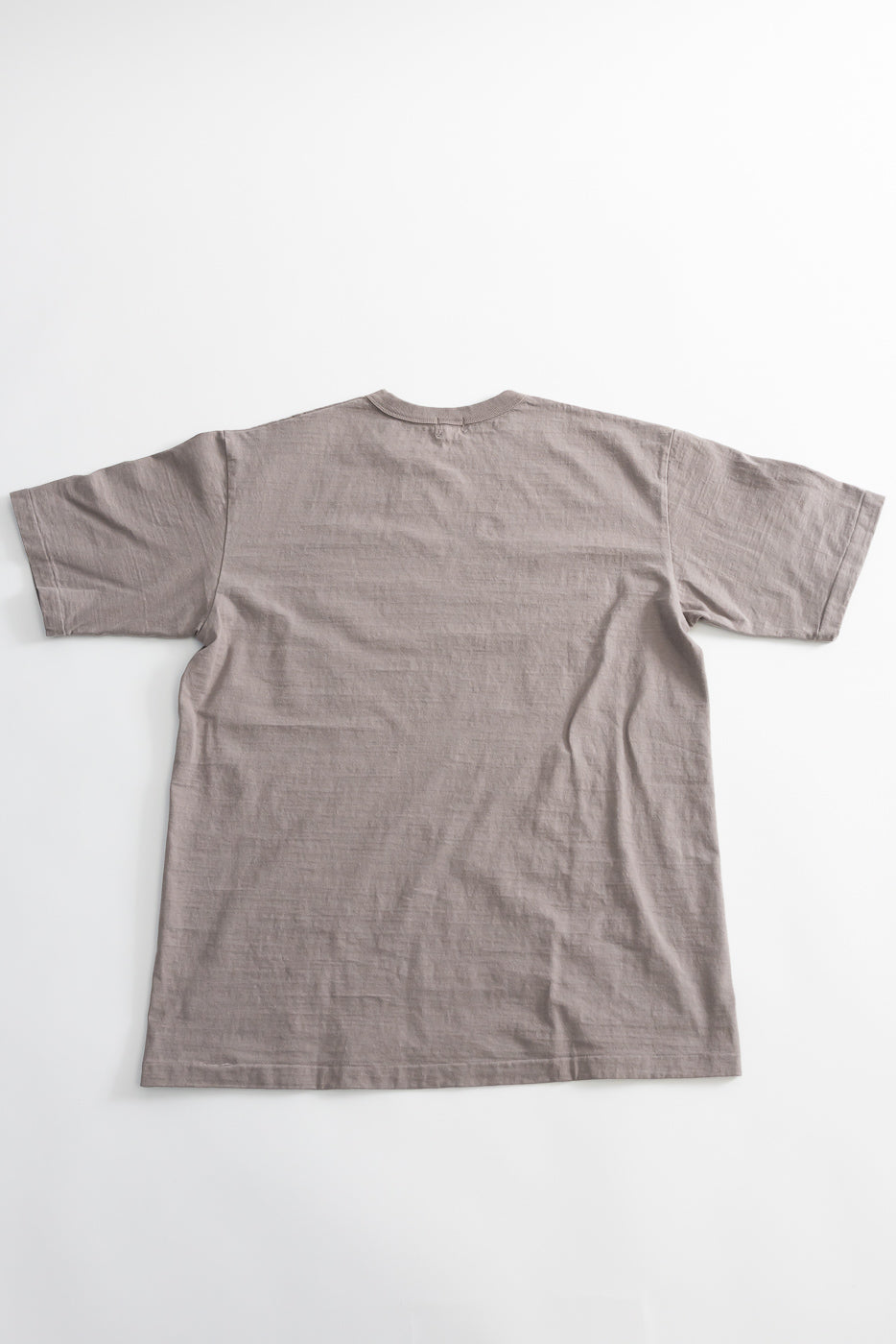 7.7oz - Fallen Cotton Midweight T-Shirt S/S - Grey, featuring a muted taupe tone, crew neckline, and short sleeves, showcasing subtle slub texture for a classic, durable look.