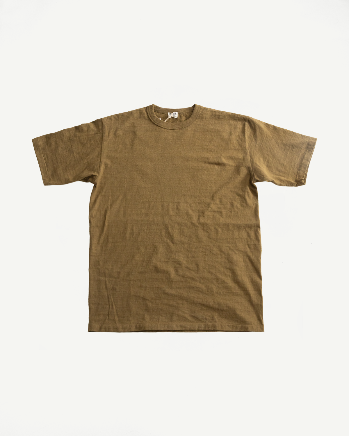 7.7oz - Fallen Cotton Midweight T-Shirt S/S - Khaki, showcasing a plain, short-sleeved, crew-neck design in muted olive-brown, emphasizes a naturally textured recycled cotton slub jersey, laid flat against a white backdrop.