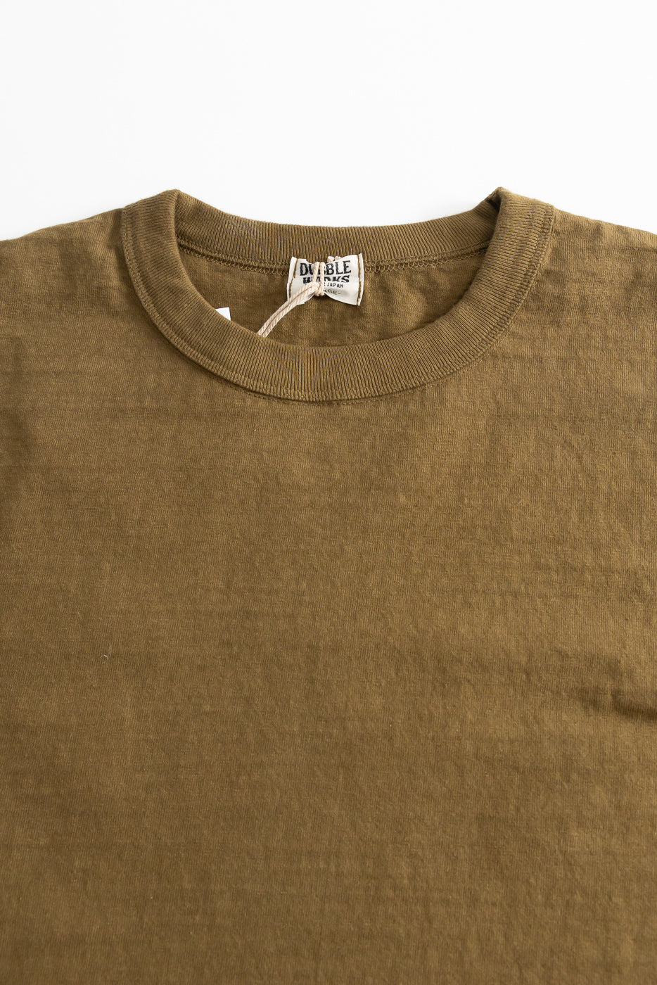 7.7oz - 'Fallen Cotton' Midweight T-Shirt S/S - Khaki, featuring a crew neck and ribbed collar on a flat-laid olive-brown fabric, highlighting its recycled cotton slub jersey texture.