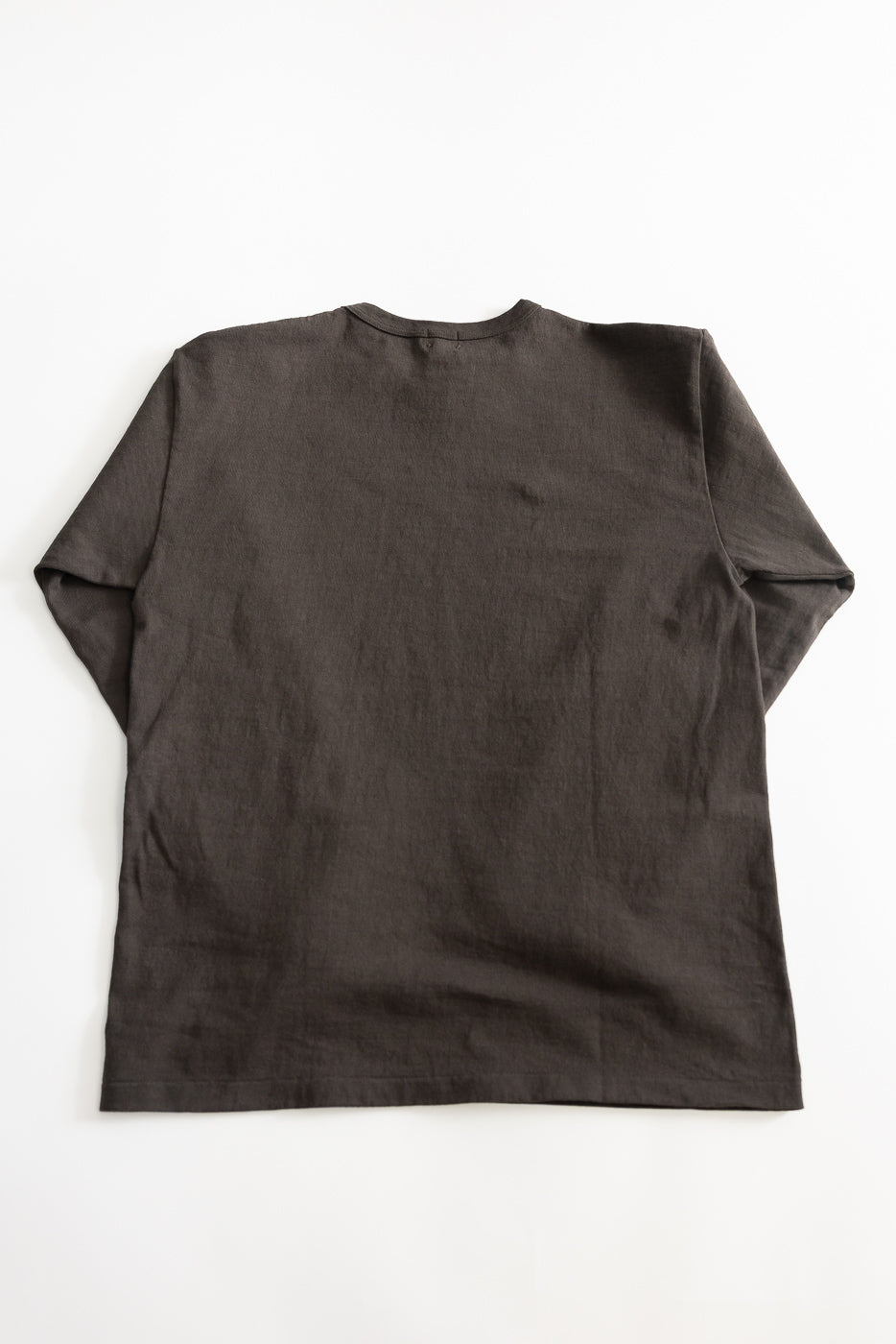 Flat lay of heavyweight sumikuro long sleeve tee, back view, showing fabric texture.