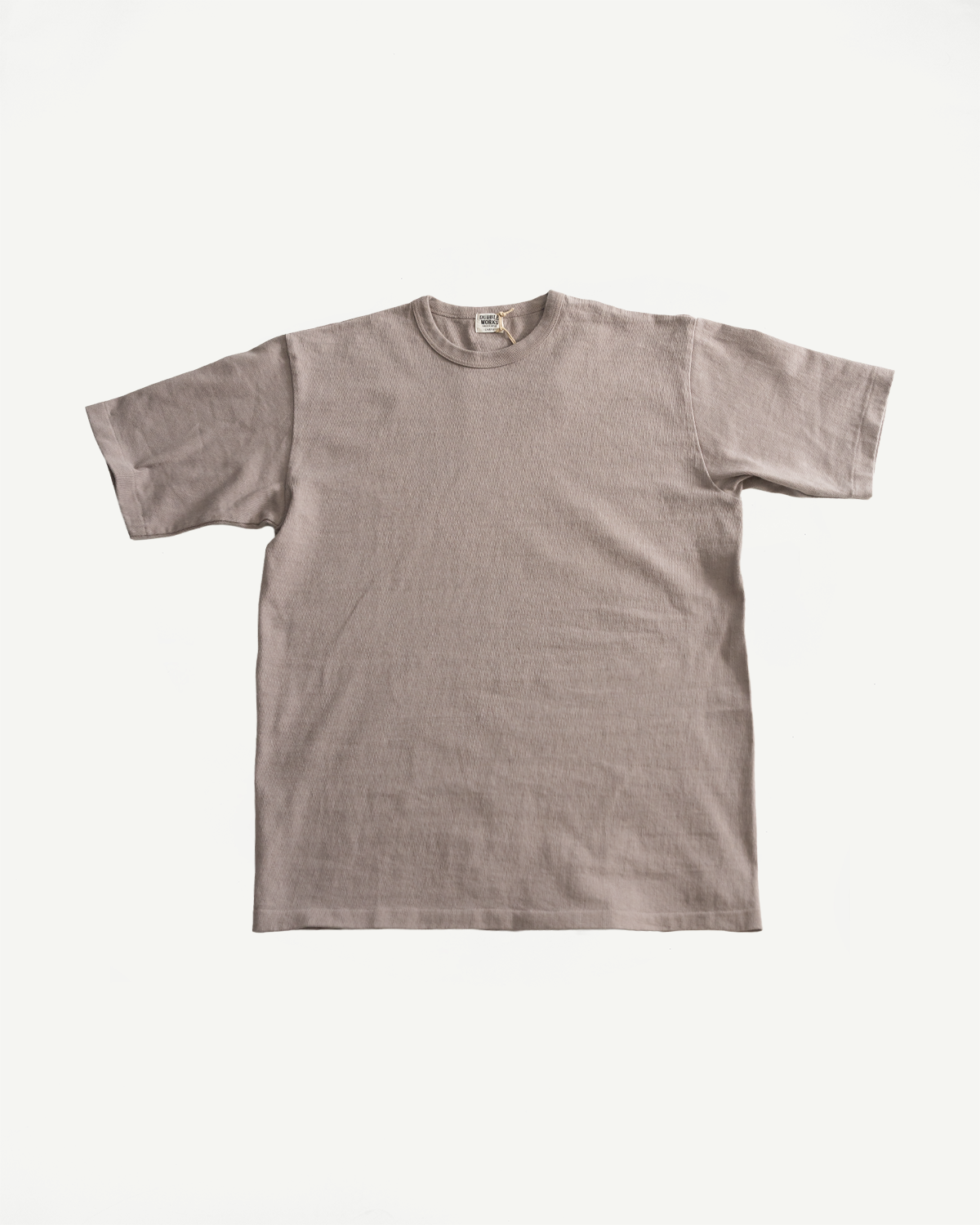 Flat lay front view of grey heavyweight short sleeve tee, ribbed crew neck, visible collar tag