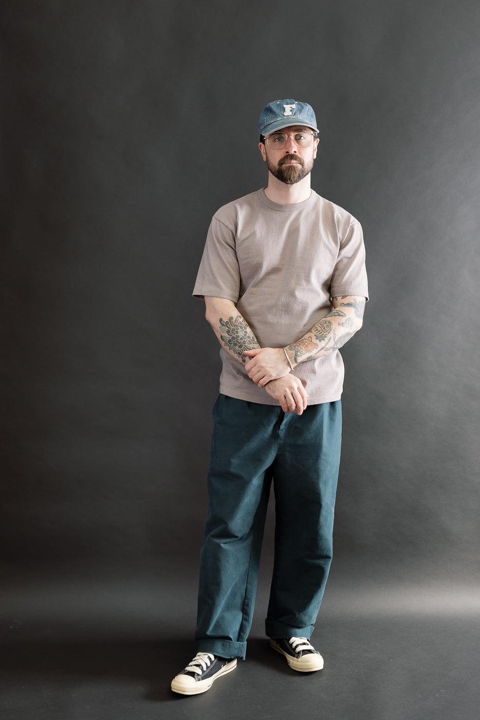 Full body front view of male model 5'9, 165lbs, athletic build wearing grey heavyweight tee