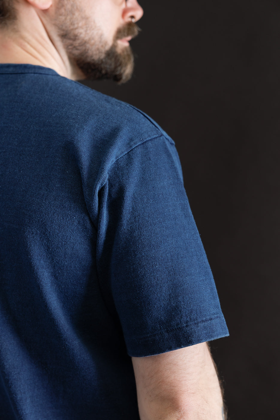 Close-up of indigo-dyed heavyweight tee, right back shoulder, on 5'9