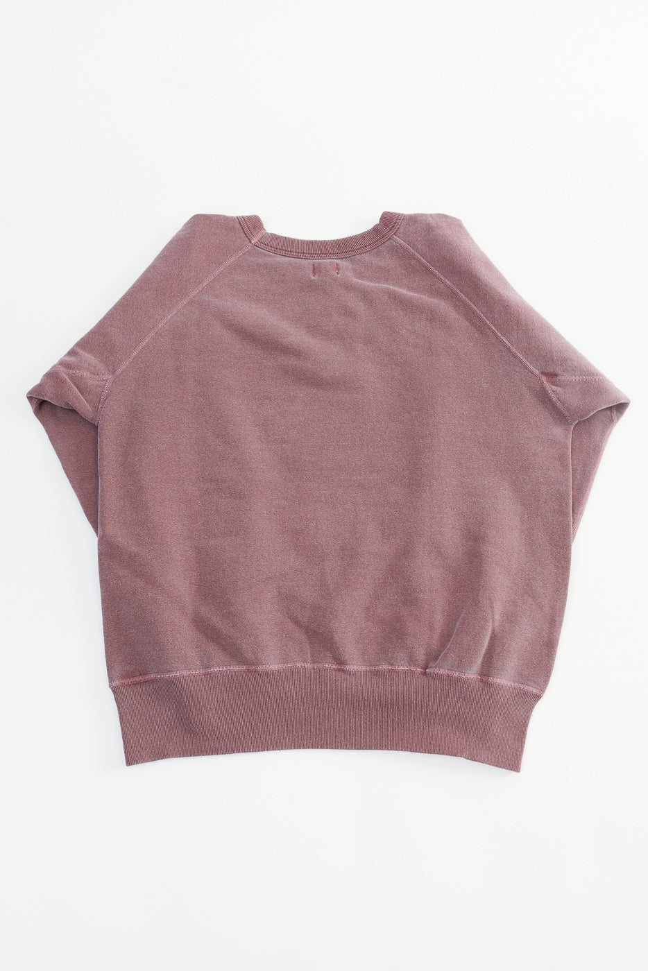 Flat lay of bordeaux sweatshirt showing back, raglan sleeves, ribbed hem, and collar details