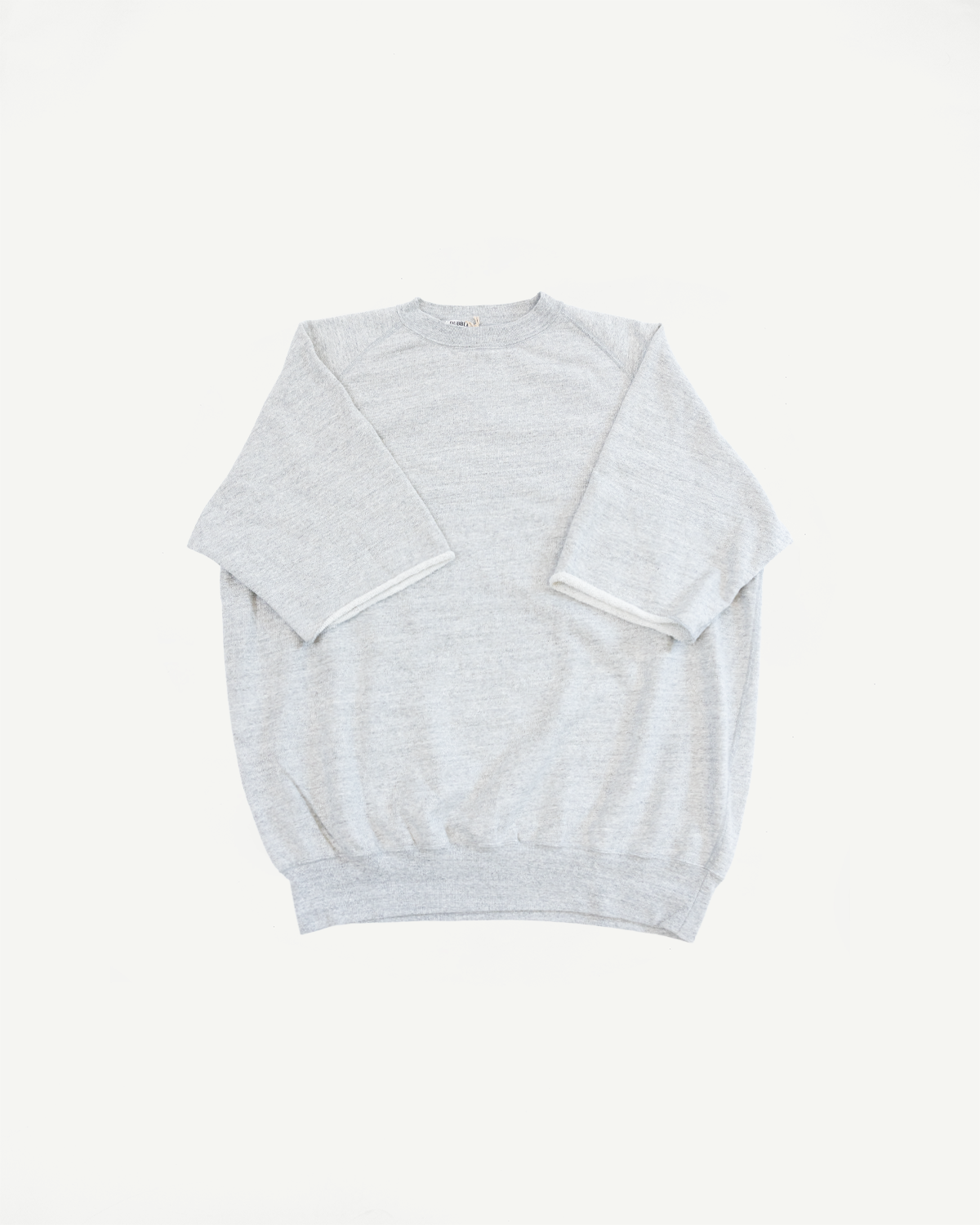 Flat lay front view of heather gray crewneck sweatshirt with ribbed hem and cuffs, raglan sleeves