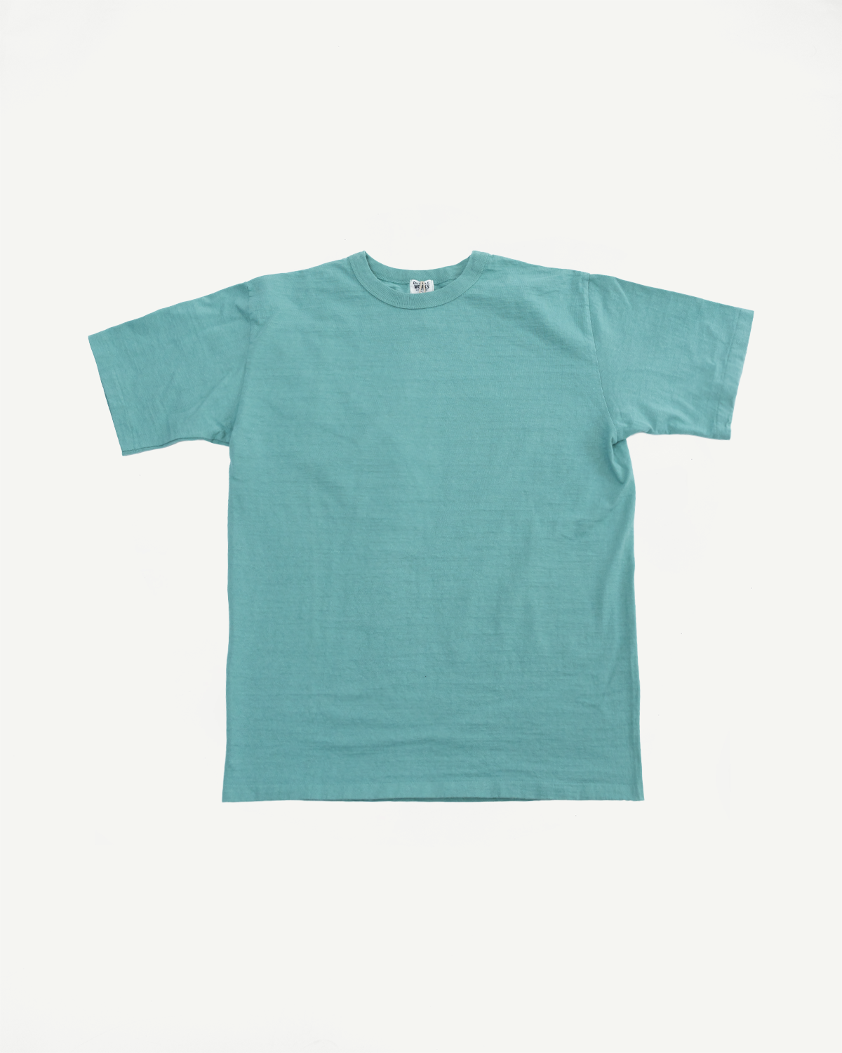 Flat lay front view of Dubble Works emerald green midweight cotton tee, short sleeves, crew neck