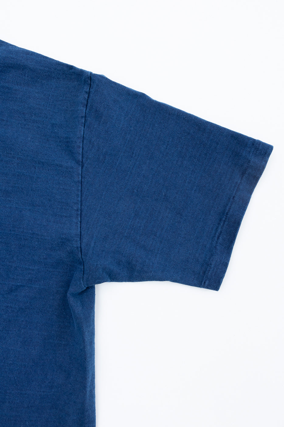 Close-up of Dubble Works indigo midweight tee right sleeve, front side fabric texture detail