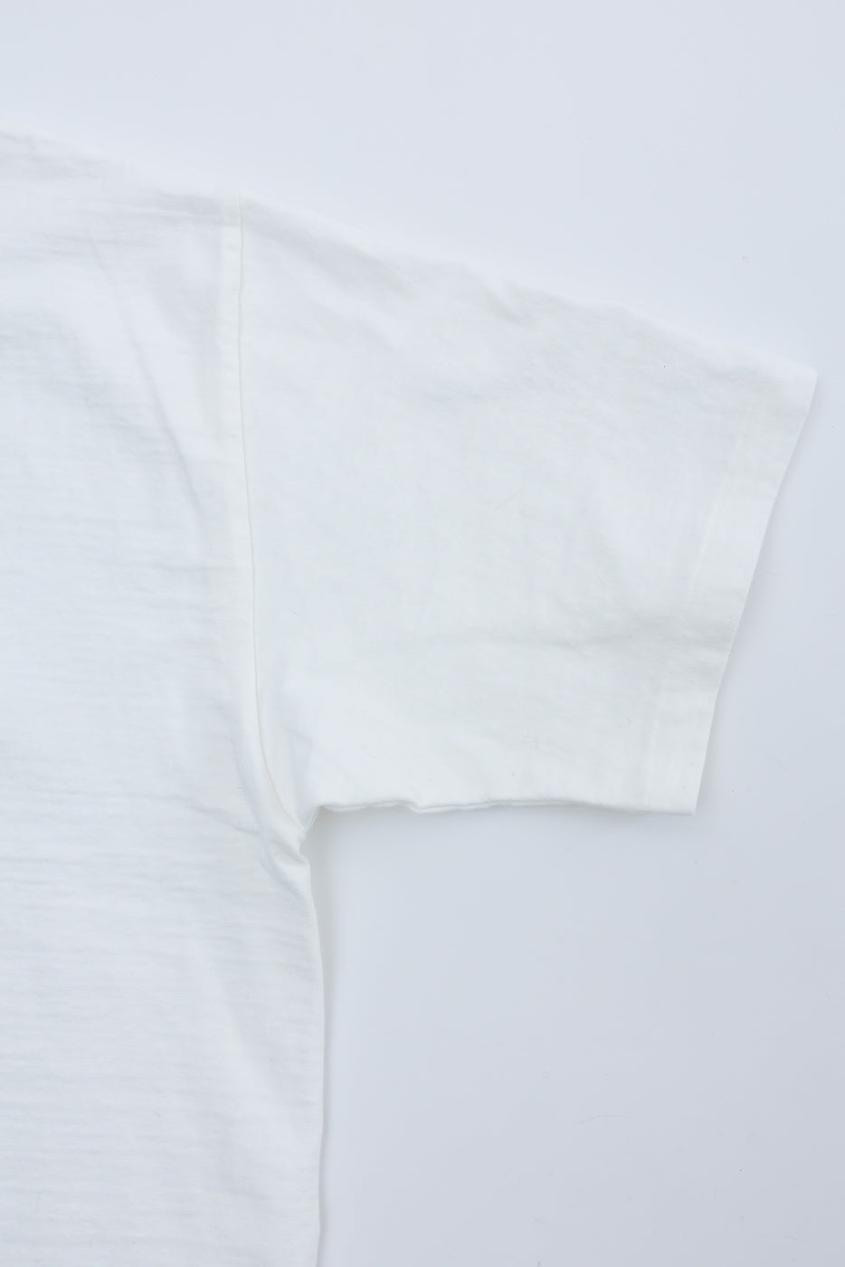 Close-up of Dubble Works Fallen Cotton Midweight Tee off-white right sleeve, flat lay front