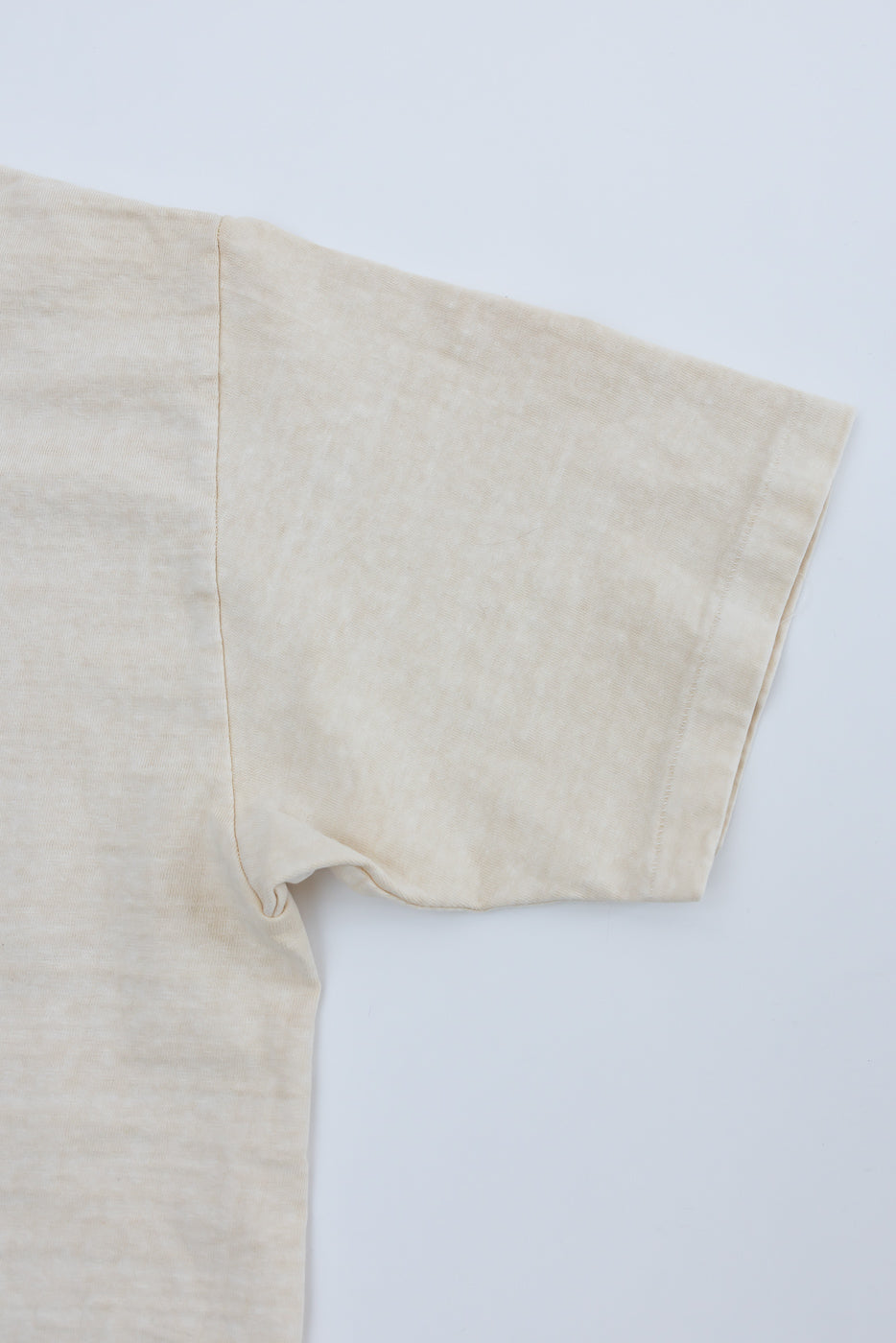 Close-up of right sleeve and side seam, Dubble Works cream midweight cotton tee front