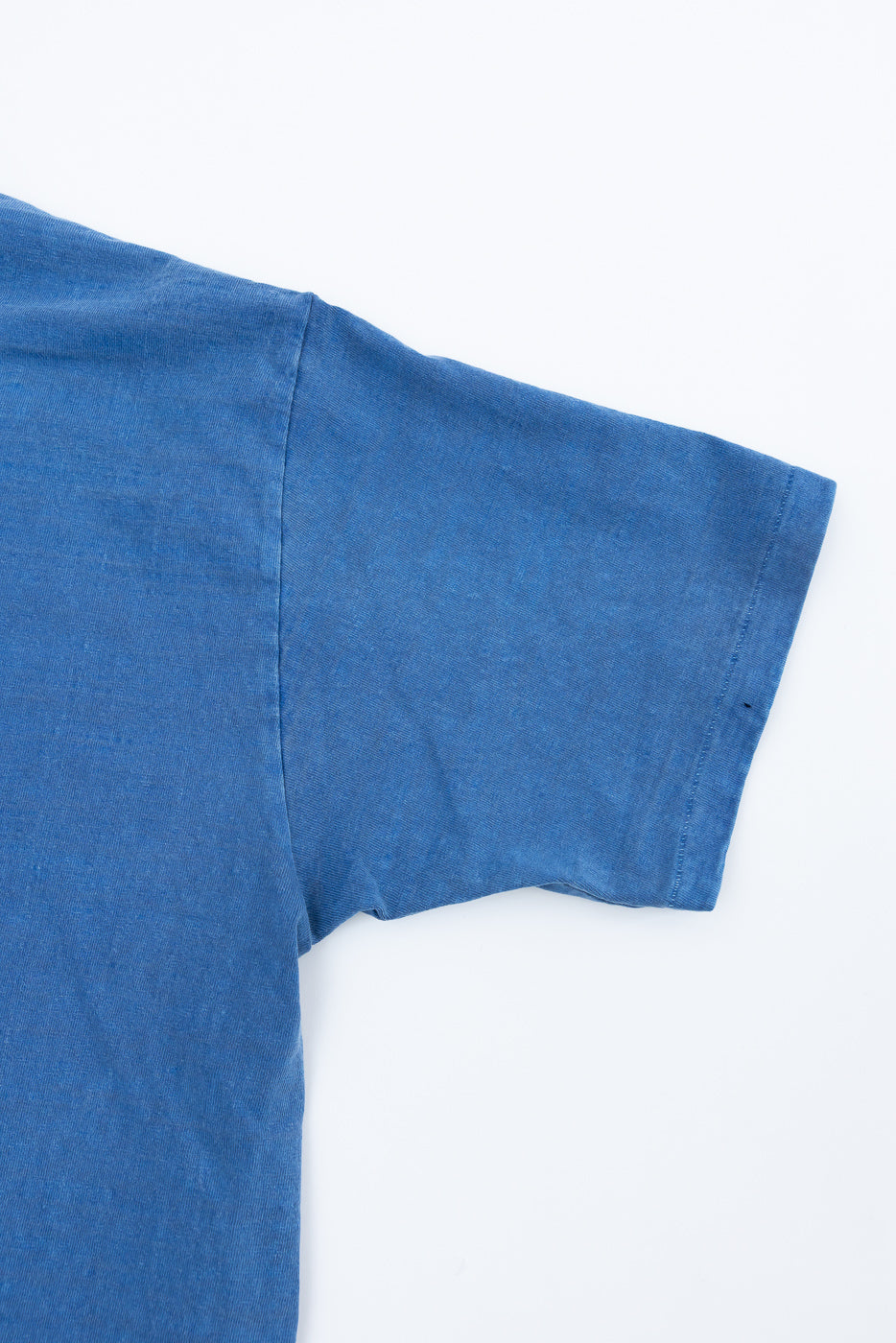 Close-up of Dubble Works Fallen Cotton midweight tee sleeve, front left arm detail, indigo blue