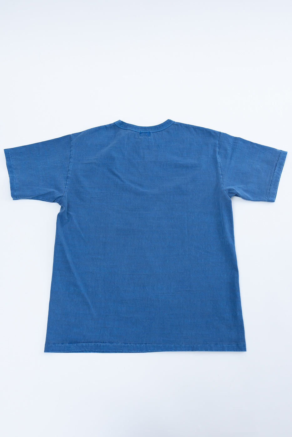 Flat lay of Dubbleworks light indigo midweight tee, full back view, short sleeves, crew neck