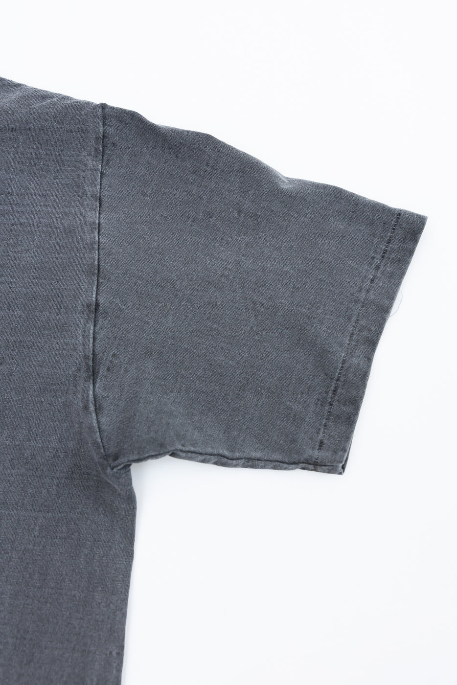 Close-up of right sleeve and side seam on Dubble Works cotton midweight tee in sumikuro grey