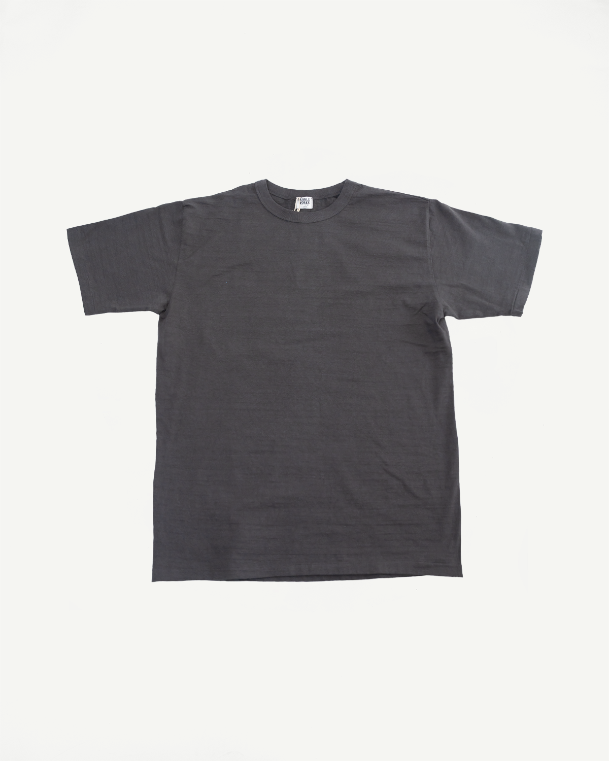 Flat lay front view of Dubble Works Sumikuro midweight cotton short sleeve tee, charcoal color, classic crewneck, straight hem, at Dant casual apparel.