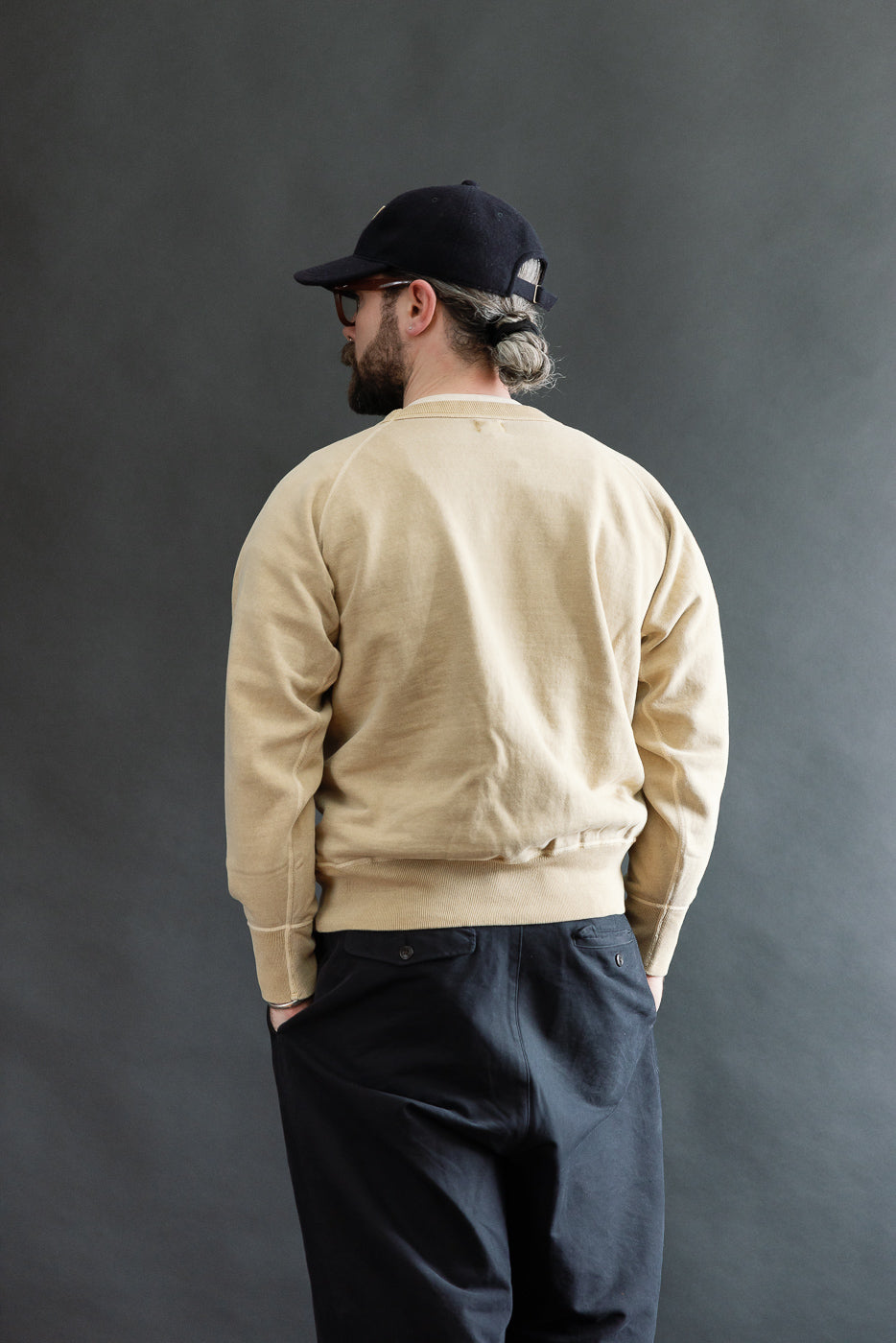 Back view, mid-shot of male model 5'9
