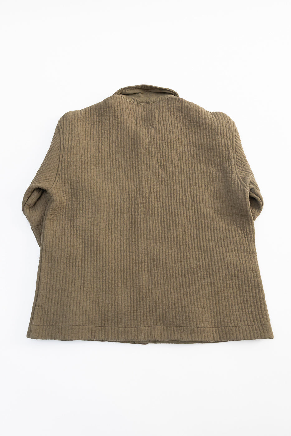 Flat lay of Eat Dust Fjord Jacquard Cana Shirt in fossil green, back view, textured fabric