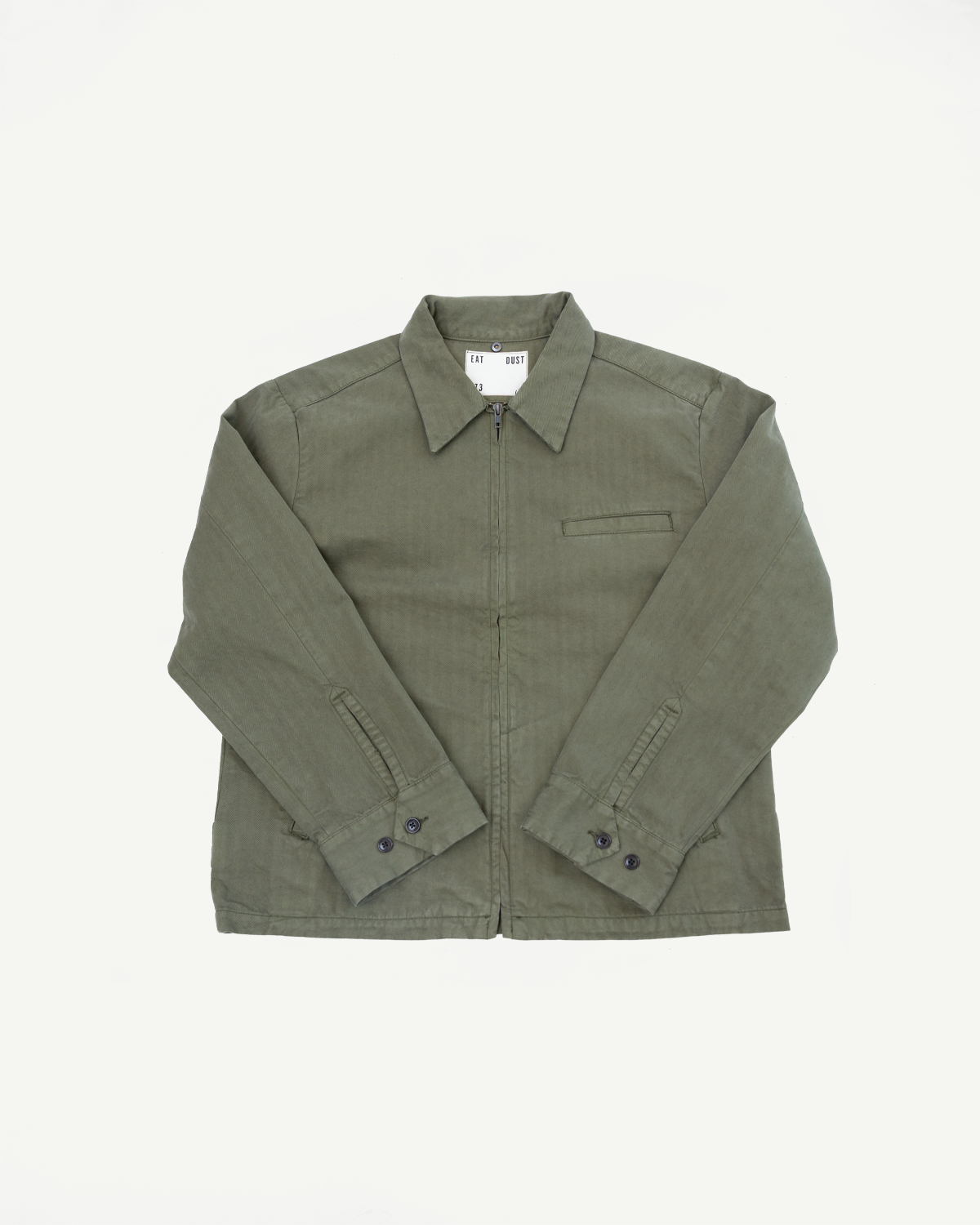 Front view flat lay of an olive green casual zip-up jacket with pointed collar and button cuffs.