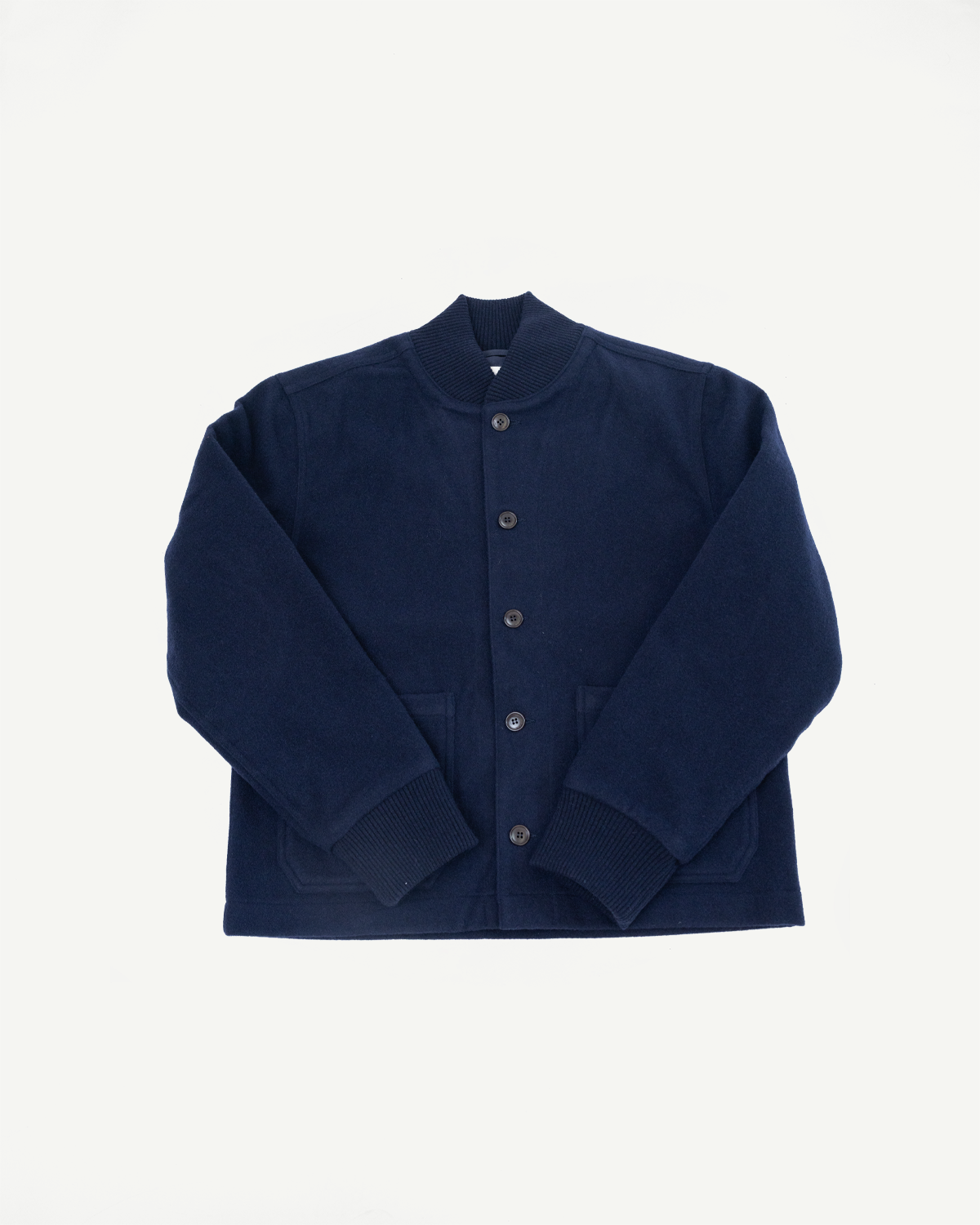 Front view flat lay of a navy blue wool bomber jacket with button closure and ribbed cuffs.