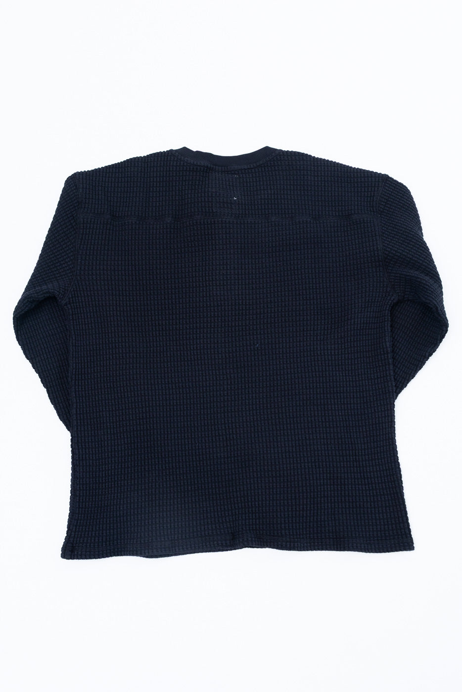 Back view flat lay of a navy blue waffle knit long sleeve thermal shirt.