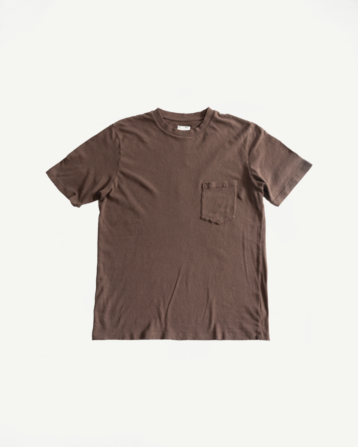 Flat lay front view of brown cotton hemp short sleeve pocket t-shirt, crew neck detail.