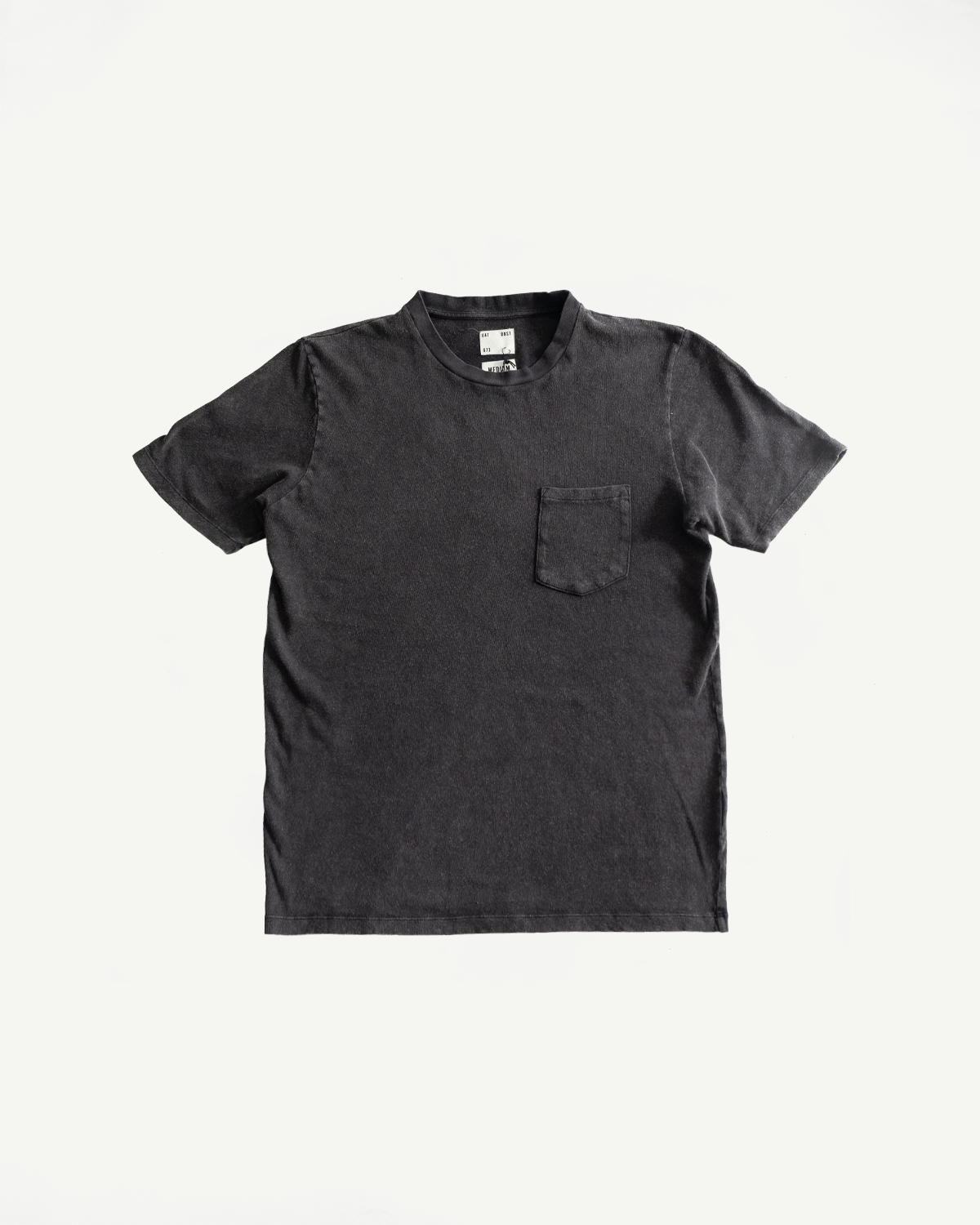 Flat lay front view of vintage black cotton-hemp men's pocket t-shirt, short sleeve, crew neck, chest pocket detail.
