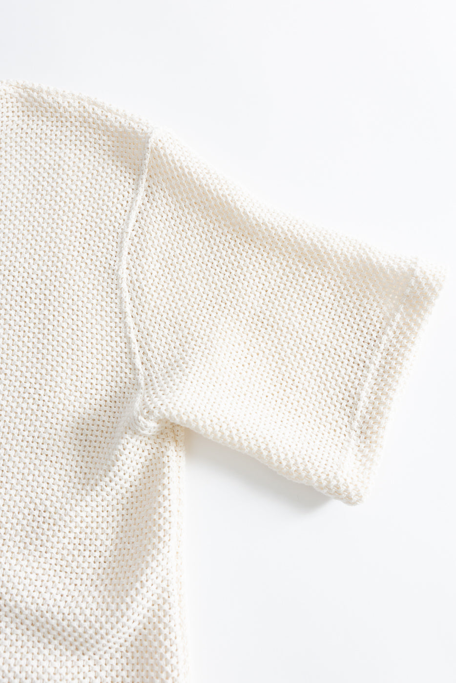 Close-up of short sleeve trellis knit cotton T-shirt, flat lay, right side detail