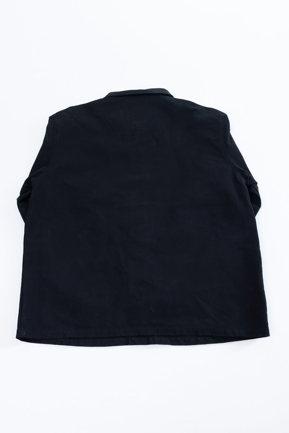 Back view flat lay of a black casual jacket showing the rear panel and hem.