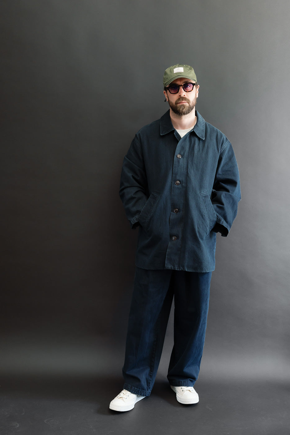 Full body front view of a male model, 5'9