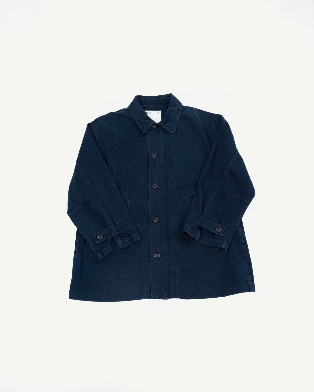 Front view flat lay of a navy blue chore coat featuring a collar and button-down front.