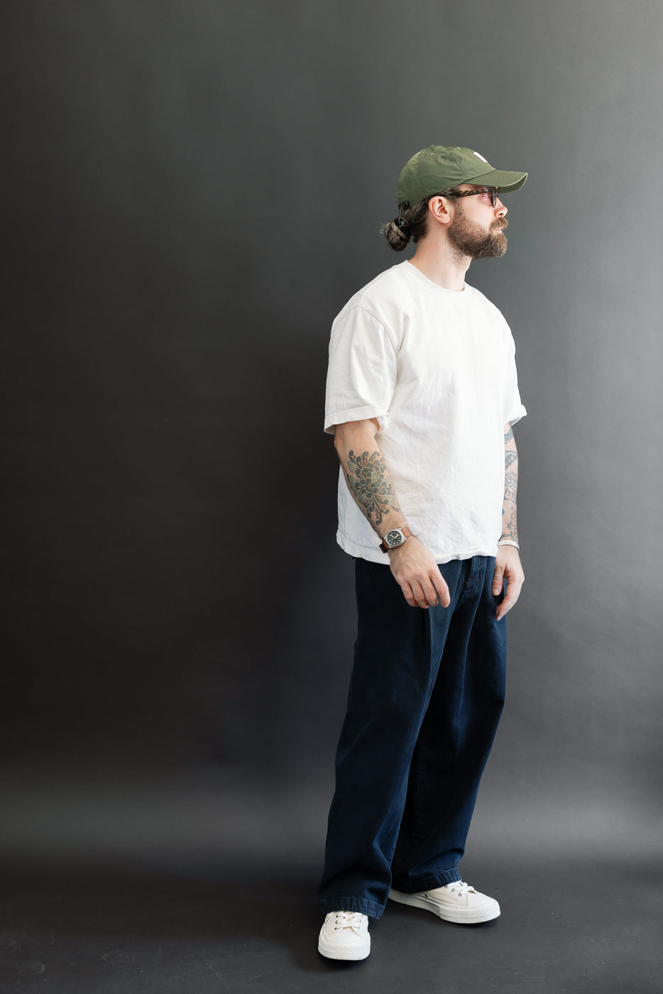 Full body side view of a male model, 5'9