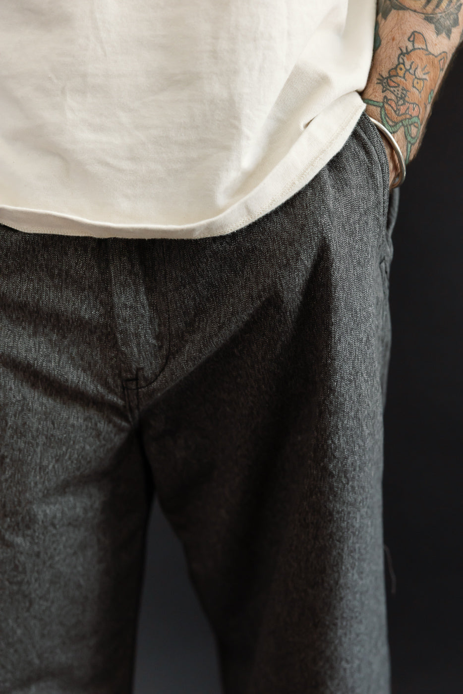 Close-up front view of dark selvedge jeans on male model, 5'9