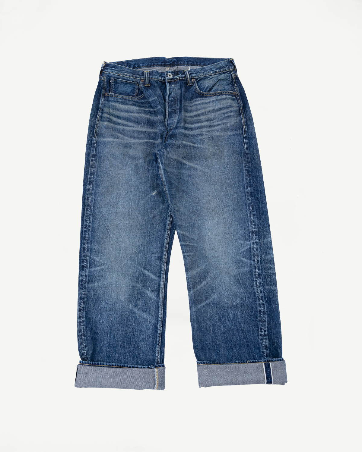 Heavily Washed indigo denim layflat with a 2