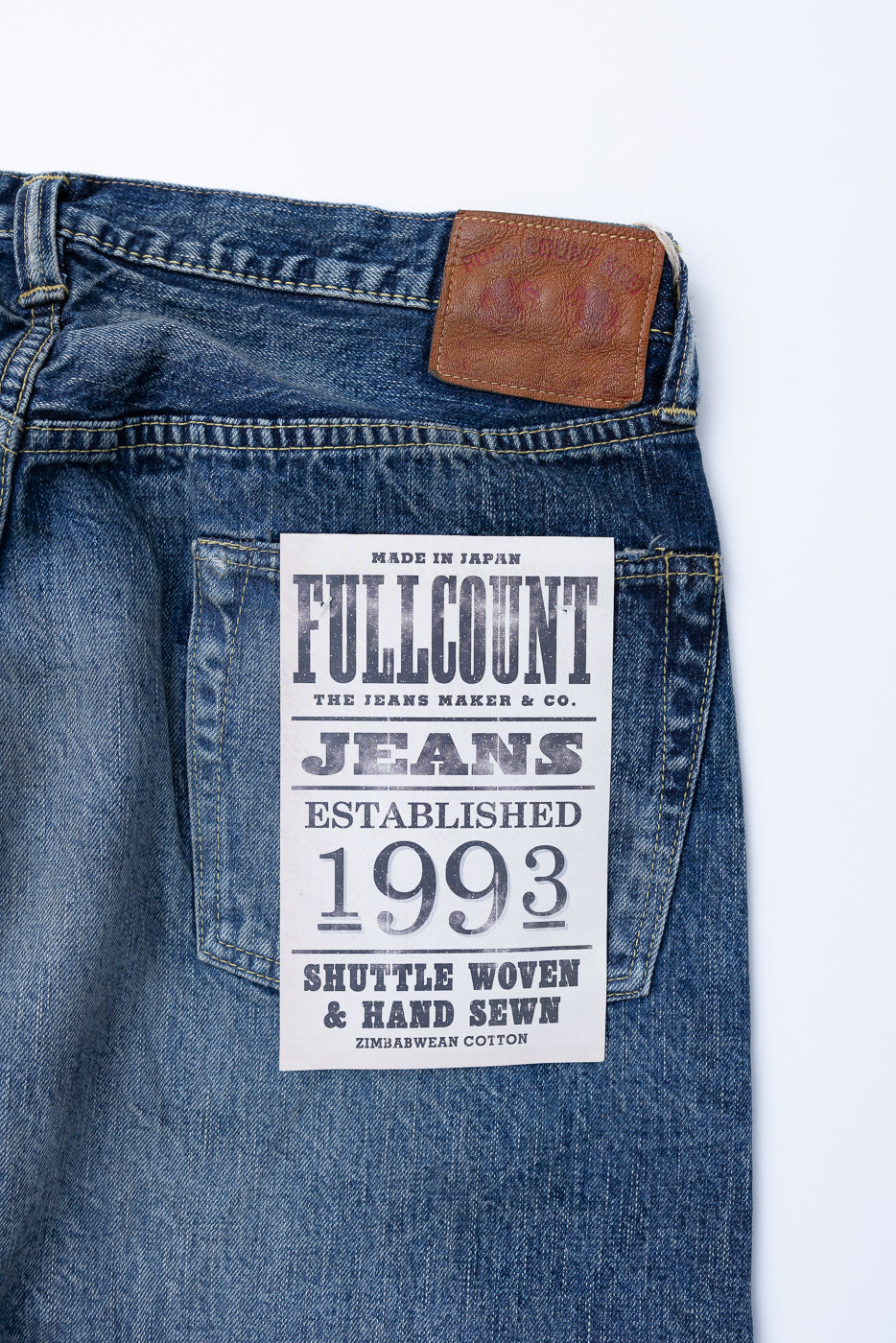 Heavily Washed indigo denim layflat with a 2