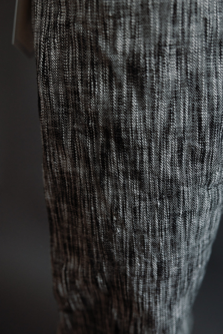 Close-up of textured selvedge denim fabric, showcasing detailed weave and gradient tones