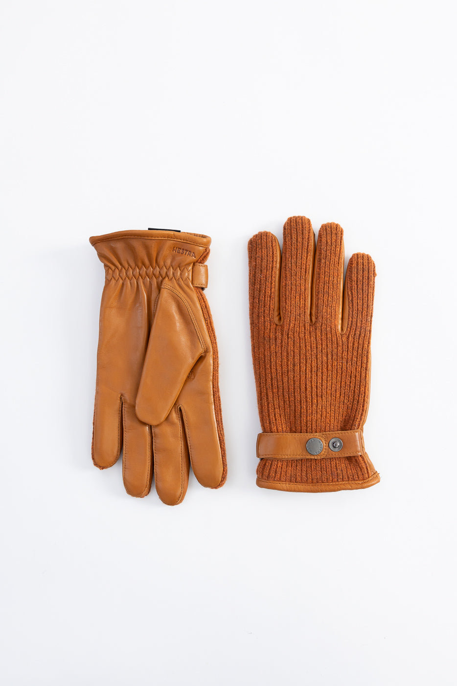 Flat lay of Hestra Christopher cork gloves, showing front and back, knit and leather details.