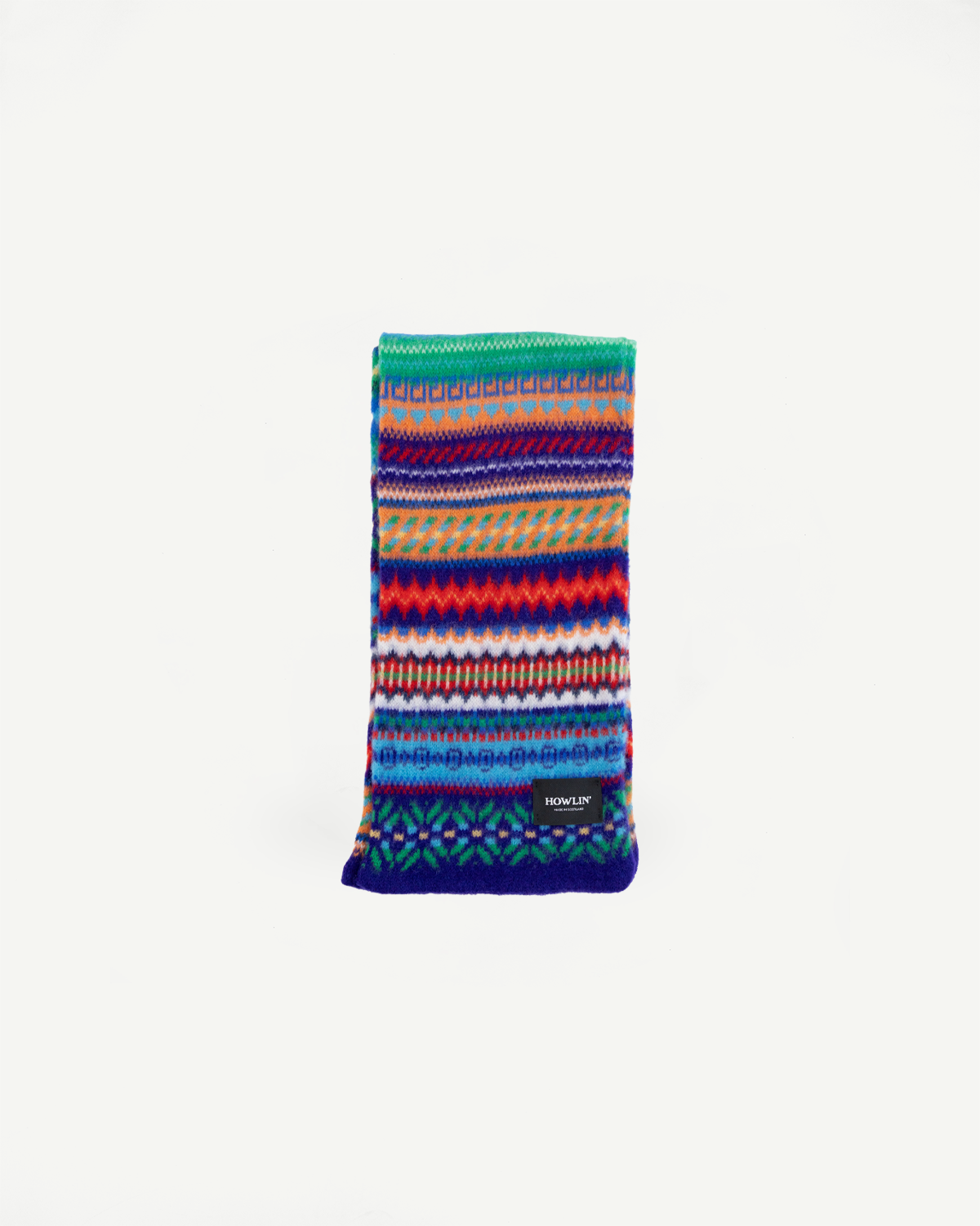 multicolored, patterned wool scarf with a purple base on a white background