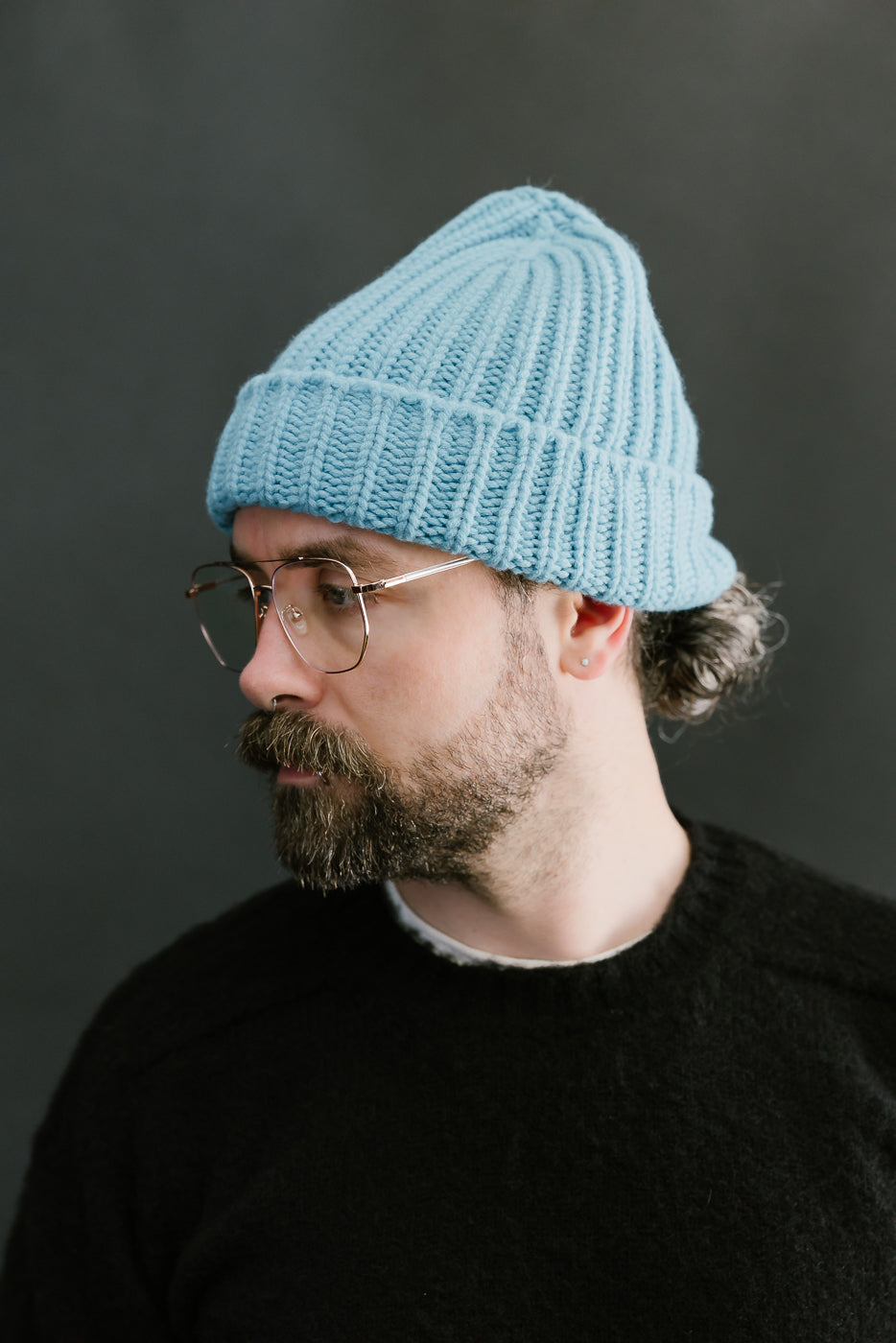 aquamarine ribbed chunky beanie, watch cap on a bearded man, side view