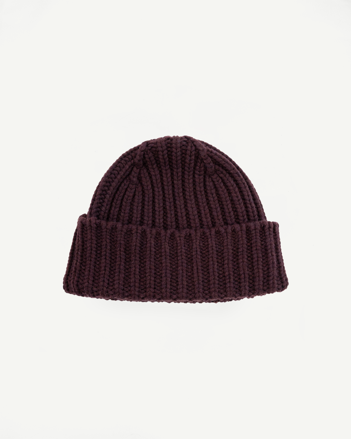 Brown knit beanie on a light gray background
