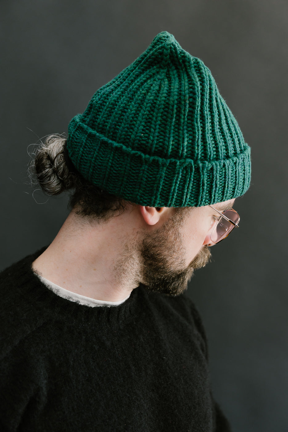 green mix ribbed chunky beanie, watch cap on bearded mans head, side view
