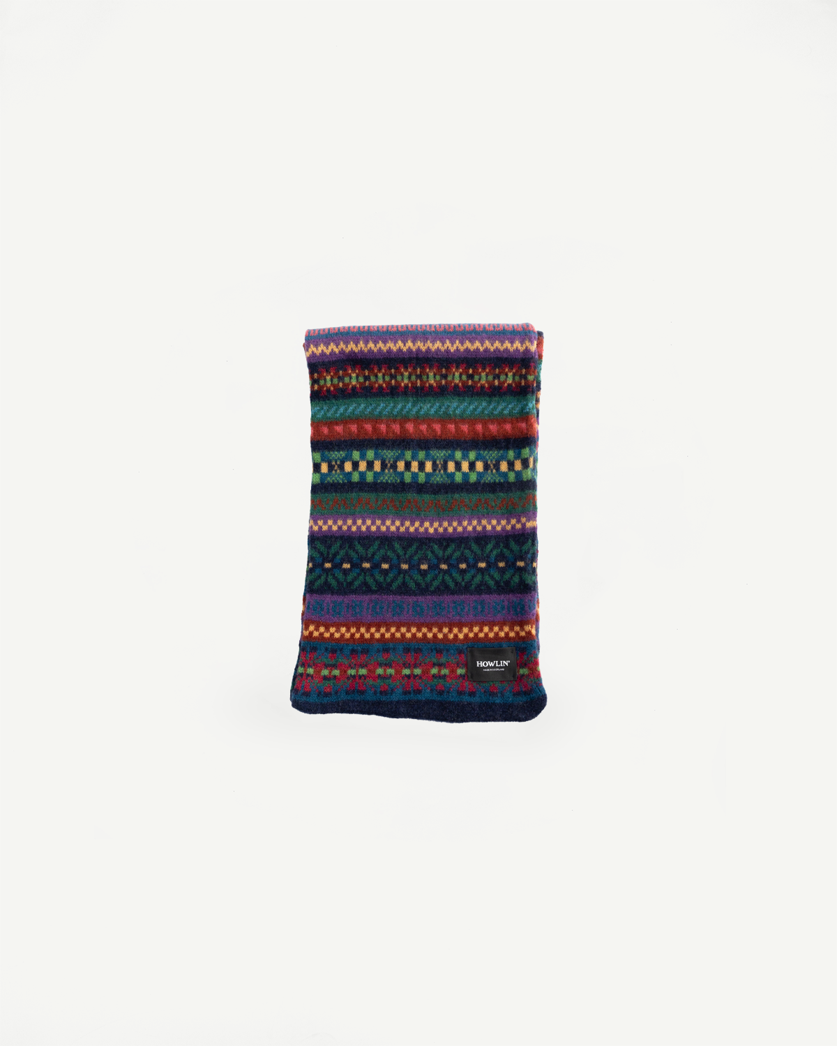Front flat lay of Howlin' Future Is Mixed Up scarf in multicolor knit, fabric texture visible, Dant
