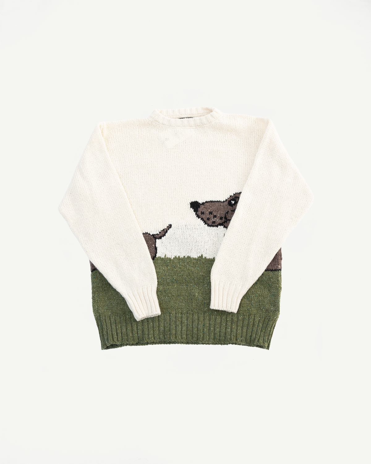 Flat lay front of ecru knit sweater with dog graphic, ribbed collar and hem, from Dant Indianapolis