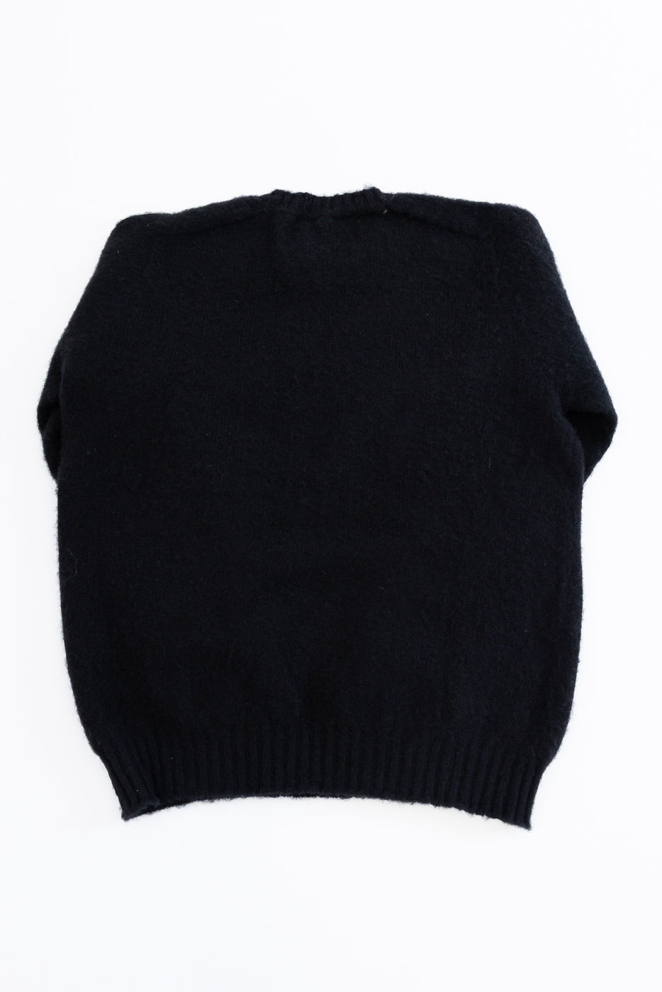 Black sweater on a white background