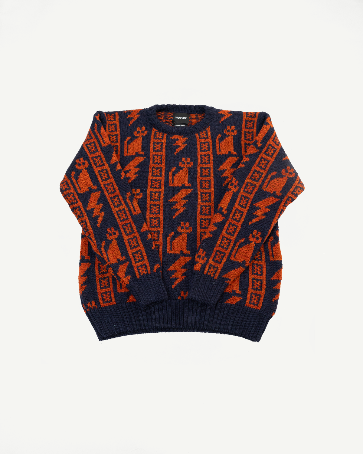 Front flat lay of Howlin' Thunder Cats navy popover sweater with orange graphic pattern, ribbed cuffs, and crew neck, contemporary casual apparel from Dant.