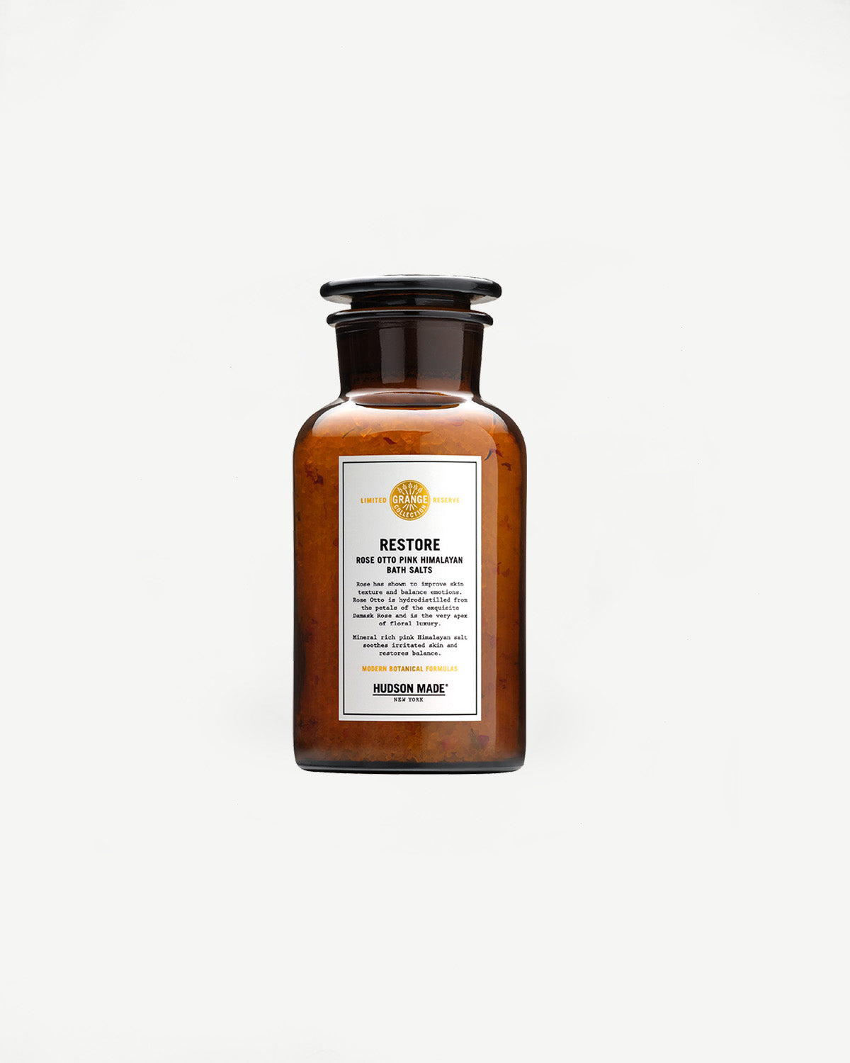 Hudson Made Restore Bath Salts in amber glass jar, front label close-up, minimalist backdrop