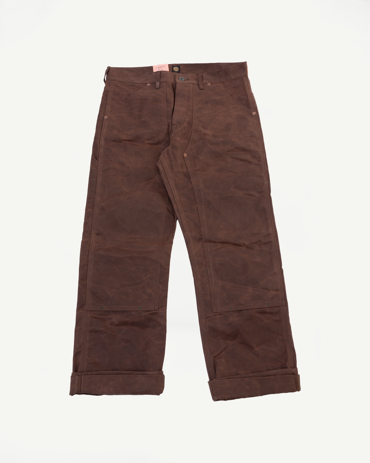 Front view flat lay of brown men's work pants with a straight leg and cuffed hem.